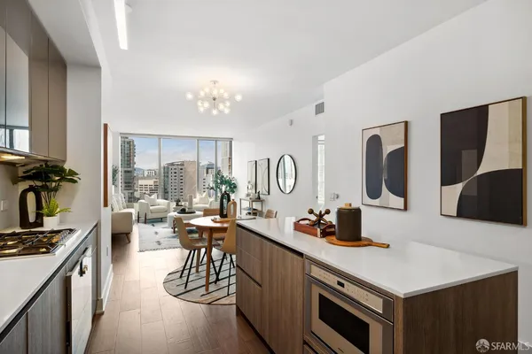 a kitchen with a sink appliances and cabinets