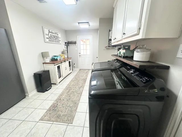 a kitchen with sink and cabinets