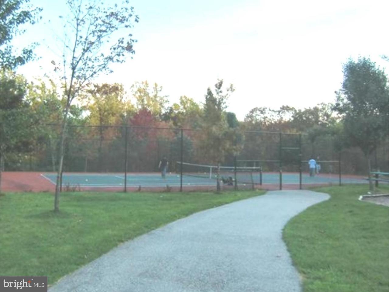 101 Avon Court Malvern, PA 19355 - Photo 20 of 20 Serene tennis courts amidst autumn hues.