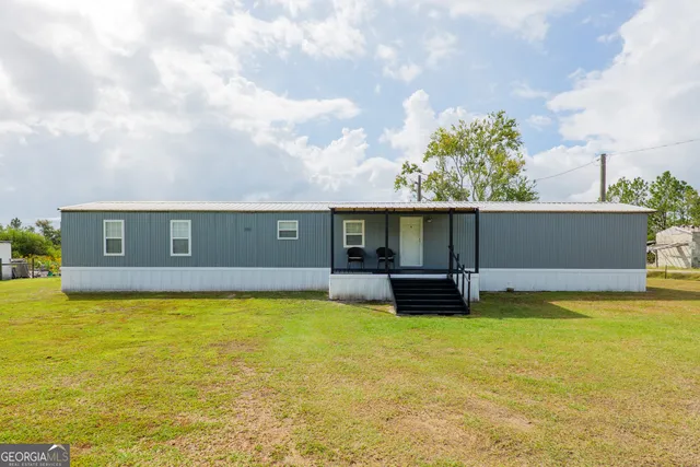 a view of a swimming pool with a table and chairs