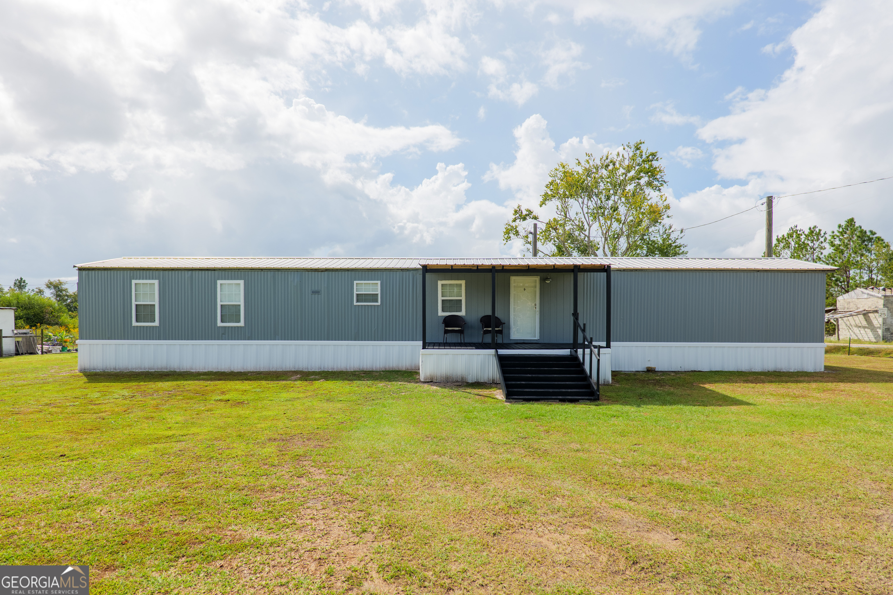 a view of a swimming pool with a table and chairs