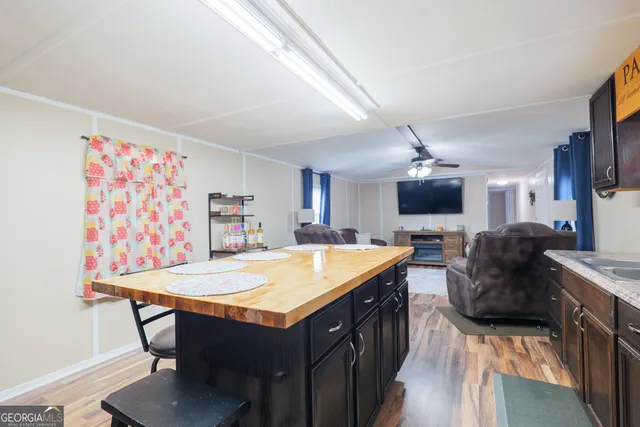 a large kitchen with a table and chairs in it