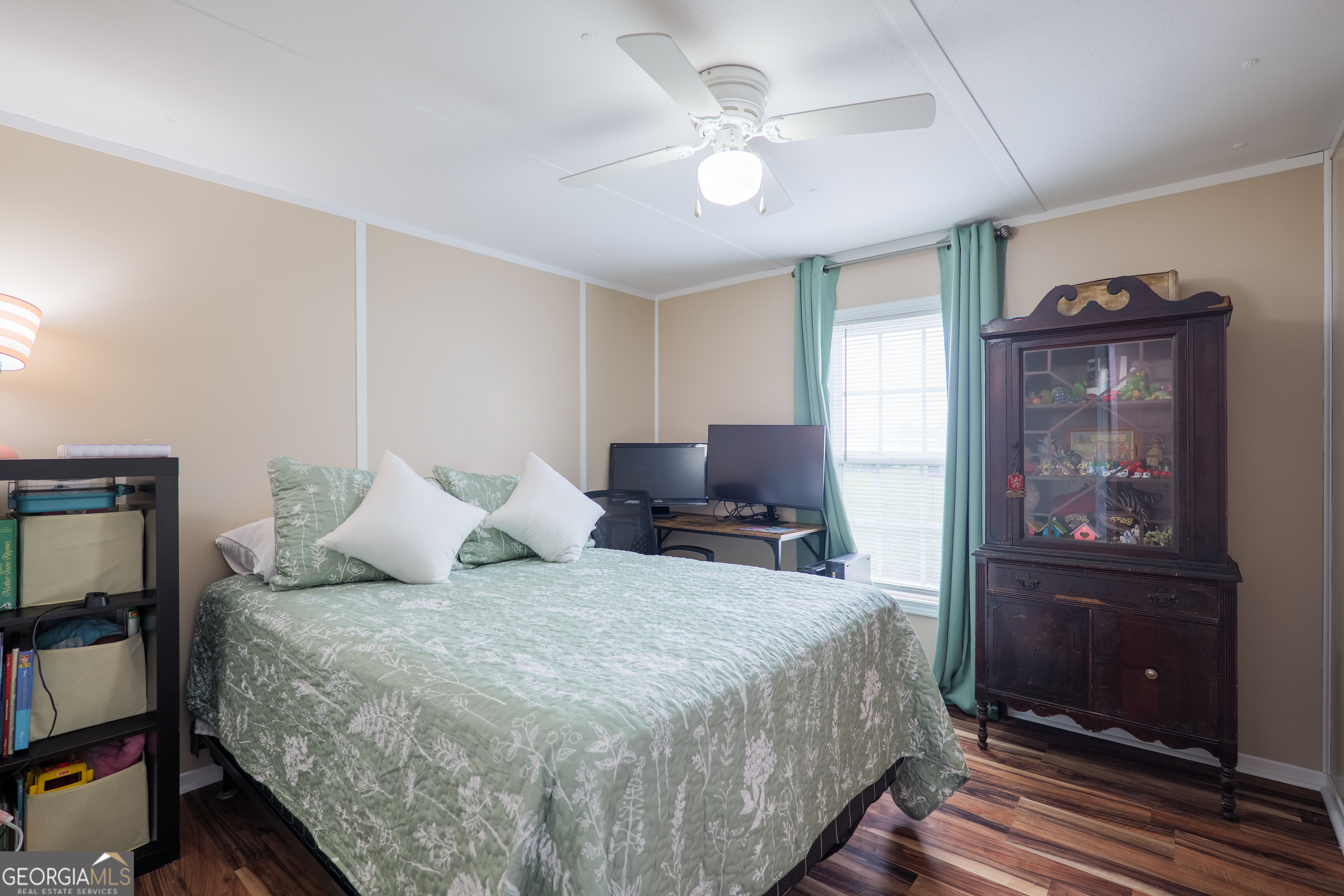 264 Cutting Road Homerville, GA 31634 - Photo 17 of 25 a bedroom with a bed and wooden floor