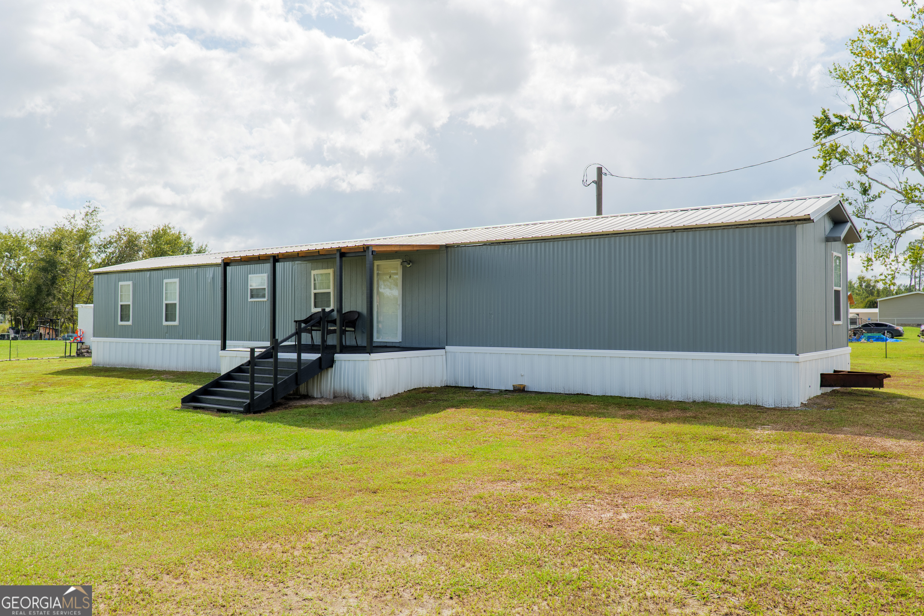 264 Cutting Road Homerville, GA 31634 - Photo 2 of 25 a view of a swimming pool and lounge chair