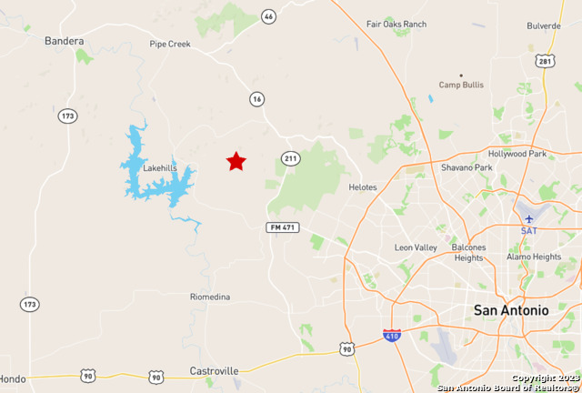 Lot 438 County Road Mico, TX 78056 - Photo 14 of 14 a bathroom with a sink and a shower curtain