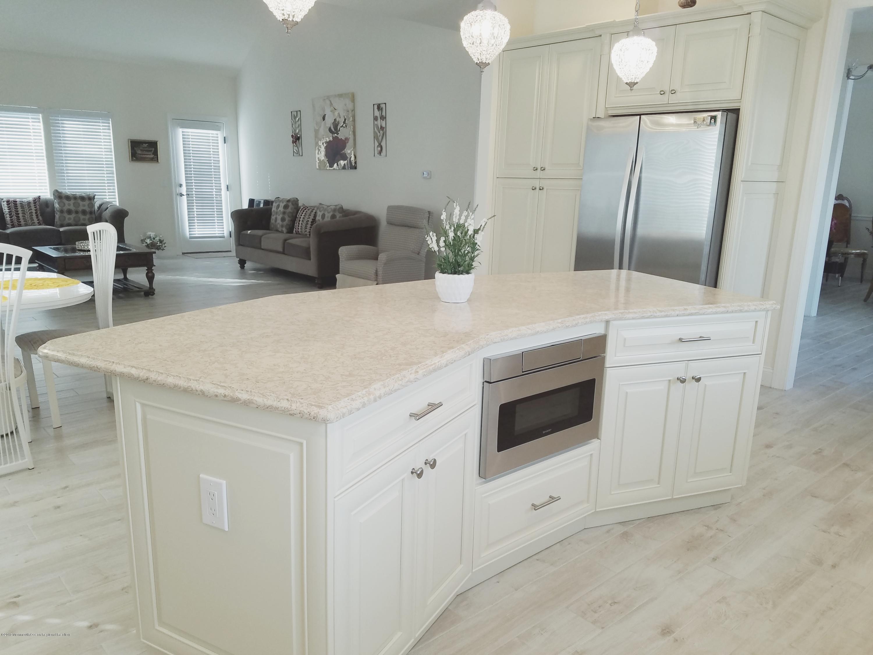 12 Cindy Court Howell, NJ 07731 - Photo 15 of 64 a spacious bathroom with a double vanity sink and mirror