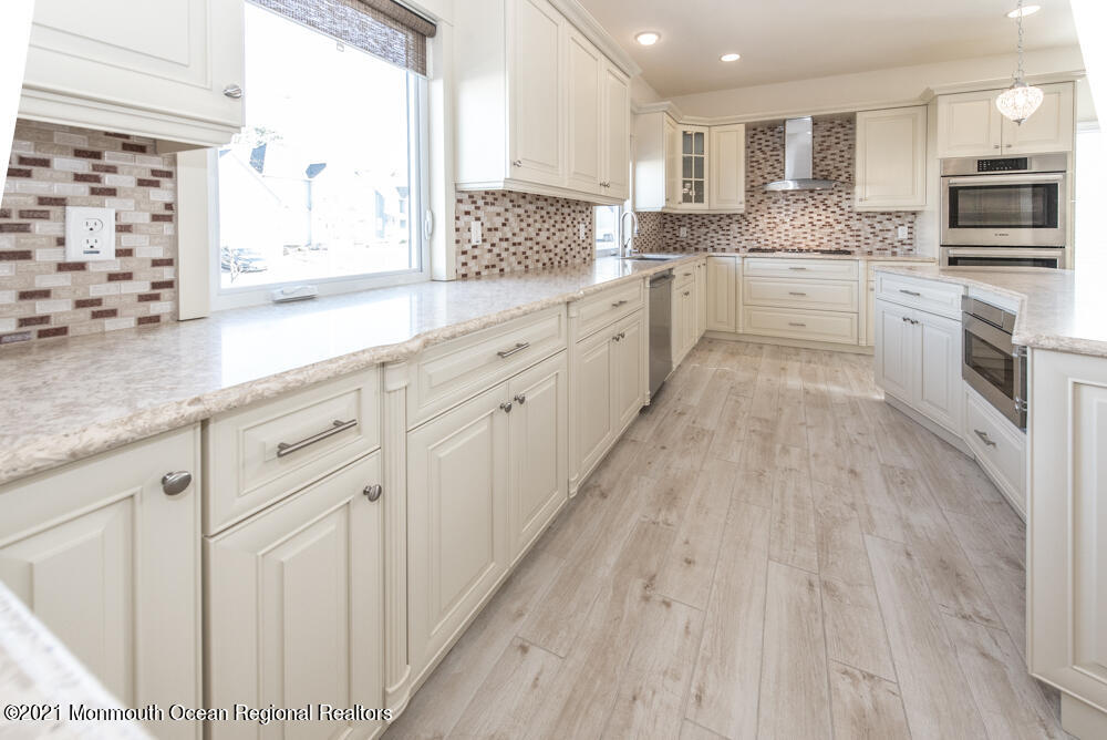 12 Cindy Court Howell, NJ 07731 - Photo 19 of 64 a large kitchen with cabinets