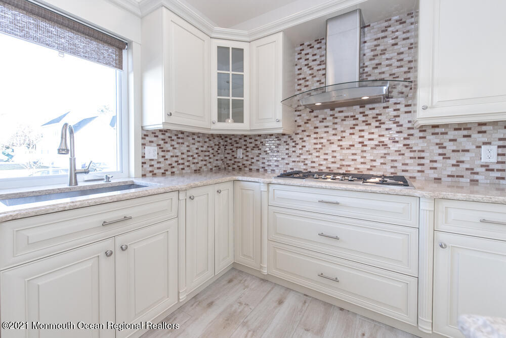 12 Cindy Court Howell, NJ 07731 - Photo 20 of 64 a bathroom with a sink and a mirror