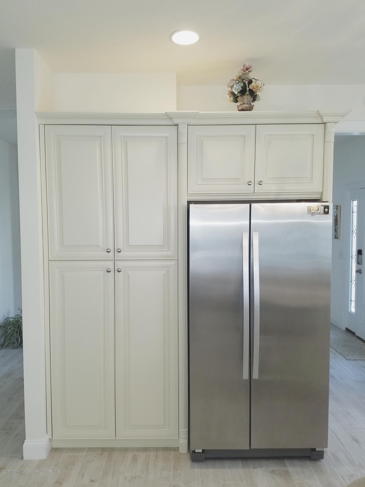 12 Cindy Court Howell, NJ 07731 - Photo 24 of 64 a view of an empty room with a fan