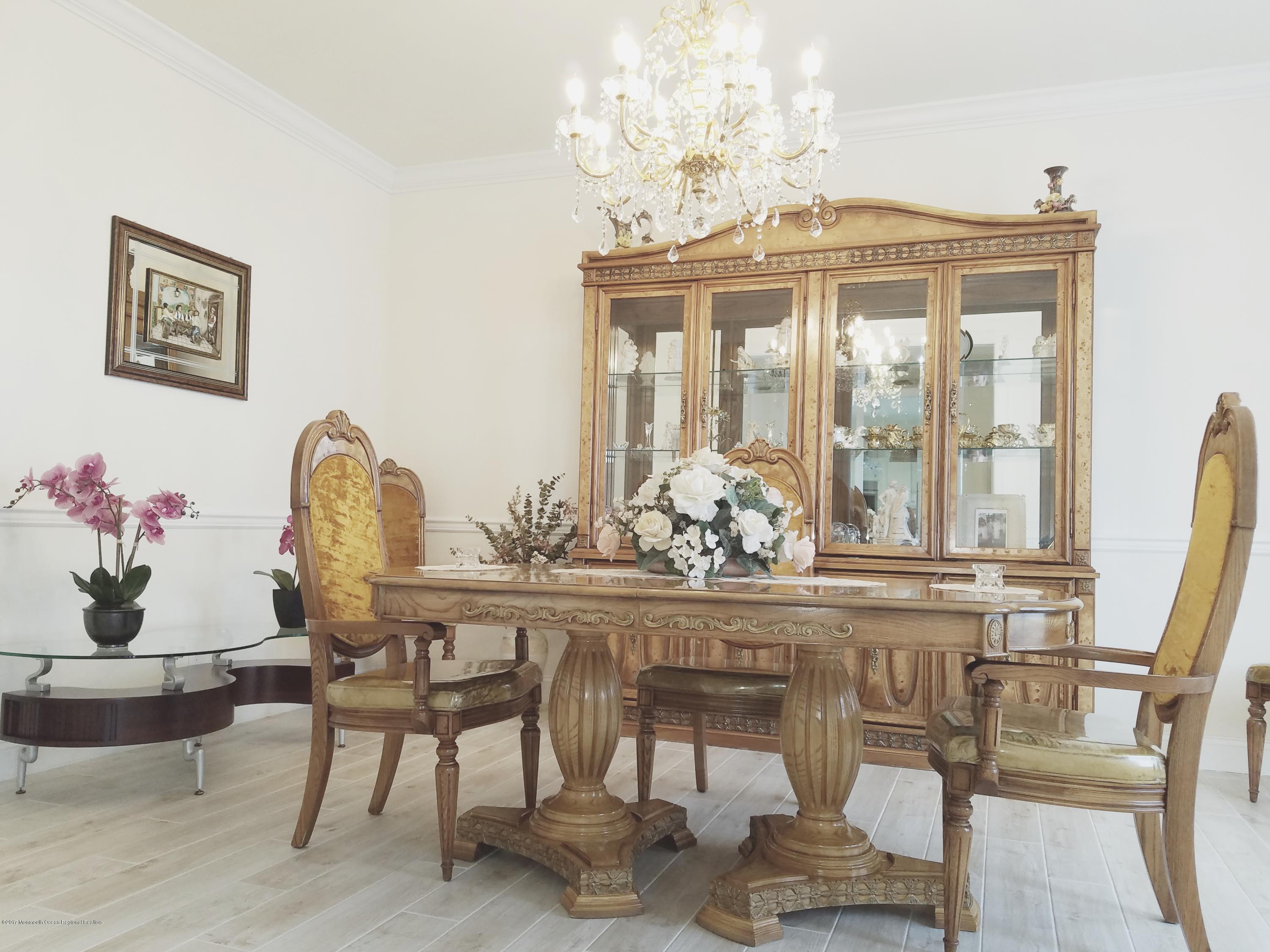 12 Cindy Court Howell, NJ 07731 - Photo 28 of 64 a view of a dining room with furniture and chandelier