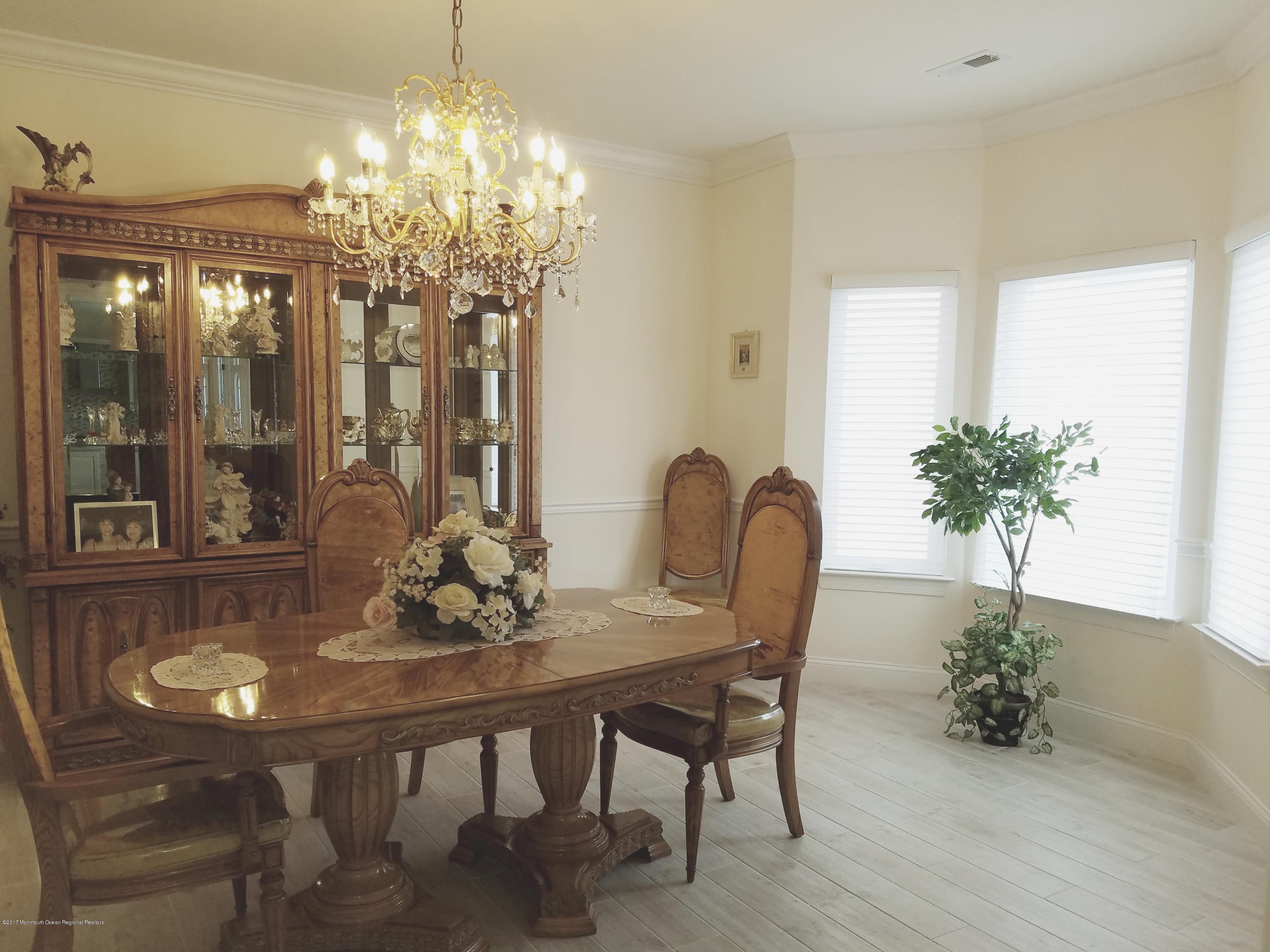 12 Cindy Court Howell, NJ 07731 - Photo 29 of 64 a dining room with furniture a chandelier and window