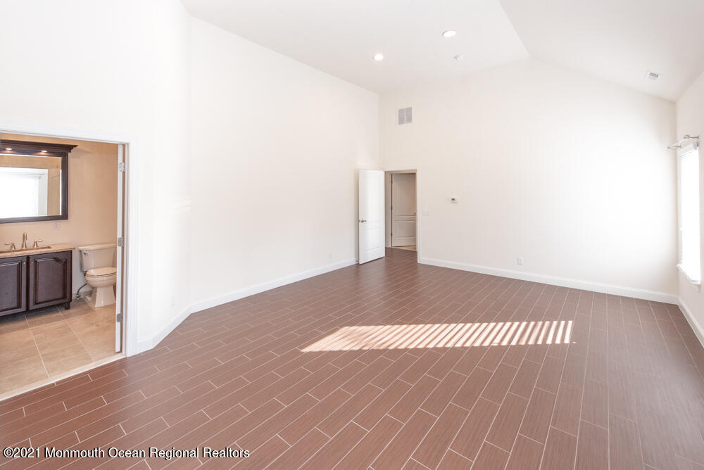 12 Cindy Court Howell, NJ 07731 - Photo 37 of 64 a view of a big room with wooden floor