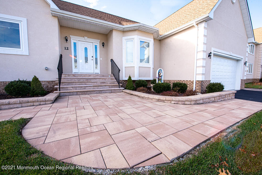 12 Cindy Court Howell, NJ 07731 - Photo 4 of 64 a front view of a house with garden