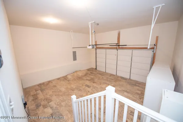 a view of an empty room with a couch