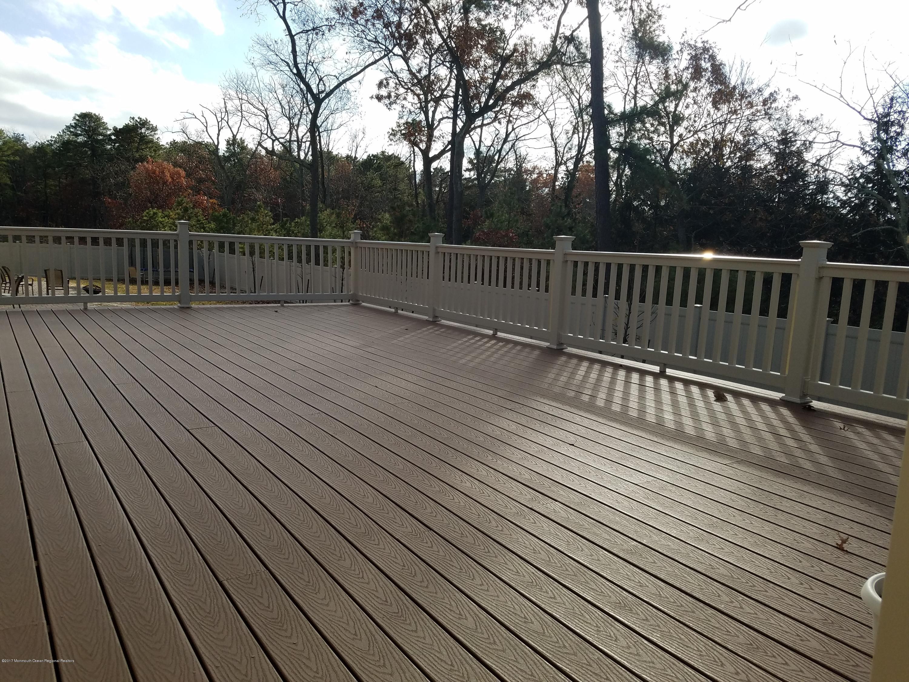12 Cindy Court Howell, NJ 07731 - Photo 51 of 64 a view of deck with wooden floor and covered with trees
