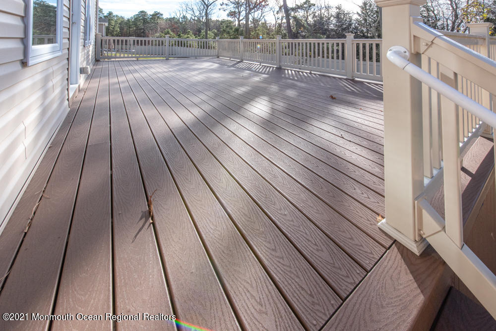 12 Cindy Court Howell, NJ 07731 - Photo 52 of 64 a view of backyard with wooden floor