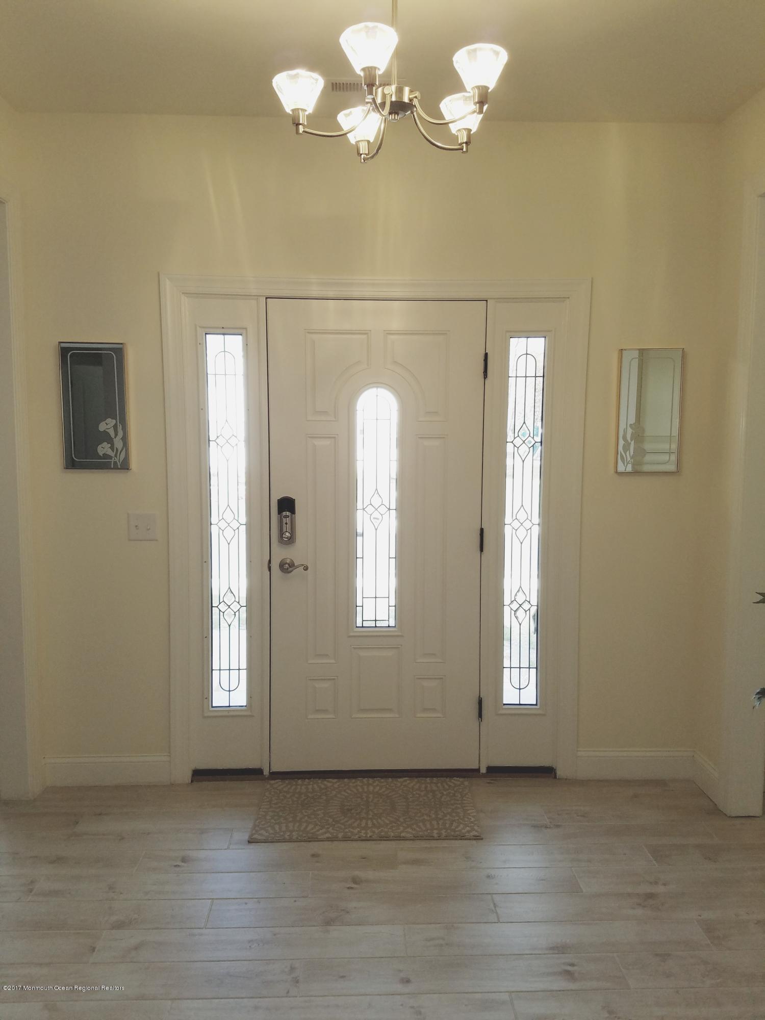 12 Cindy Court Howell, NJ 07731 - Photo 8 of 64 wooden floor in an empty room with a window
