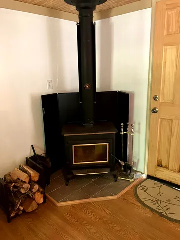 a living room with furniture a window and a fireplace