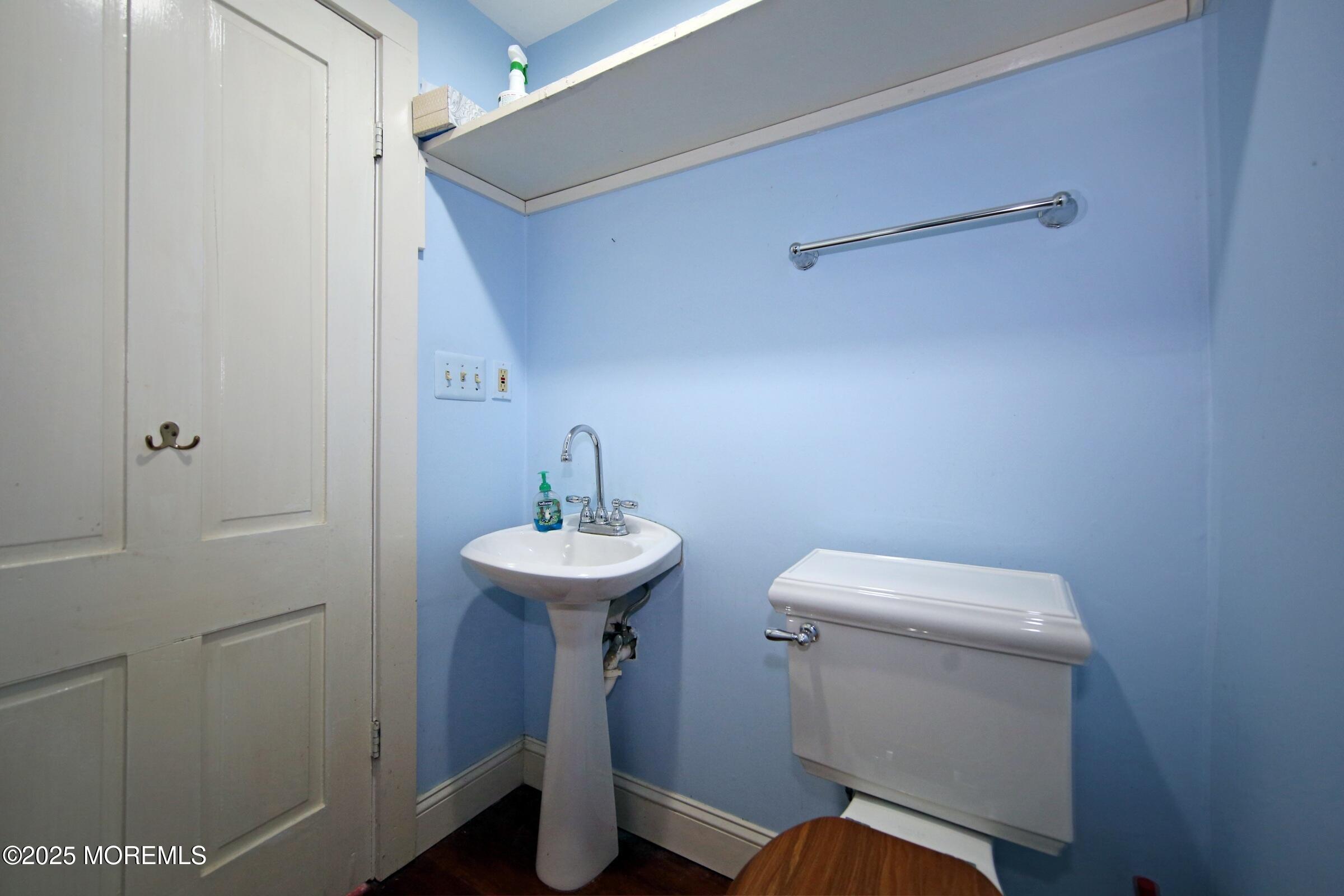 40 Riverside Avenue Oceanport, NJ 07757 - Photo 19 of 62 a bathroom with a toilet sink and mirror