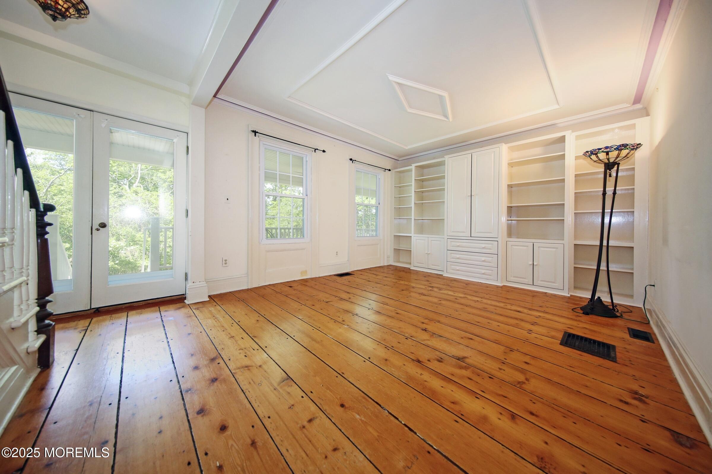40 Riverside Avenue Oceanport, NJ 07757 - Photo 20 of 62 an empty room with wooden floor and windows
