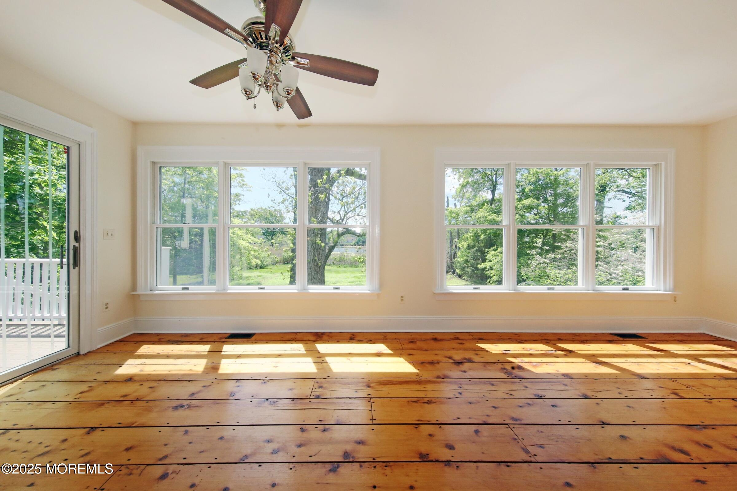 40 Riverside Avenue Oceanport, NJ 07757 - Photo 22 of 62 a view of an empty room with wooden floor and a window