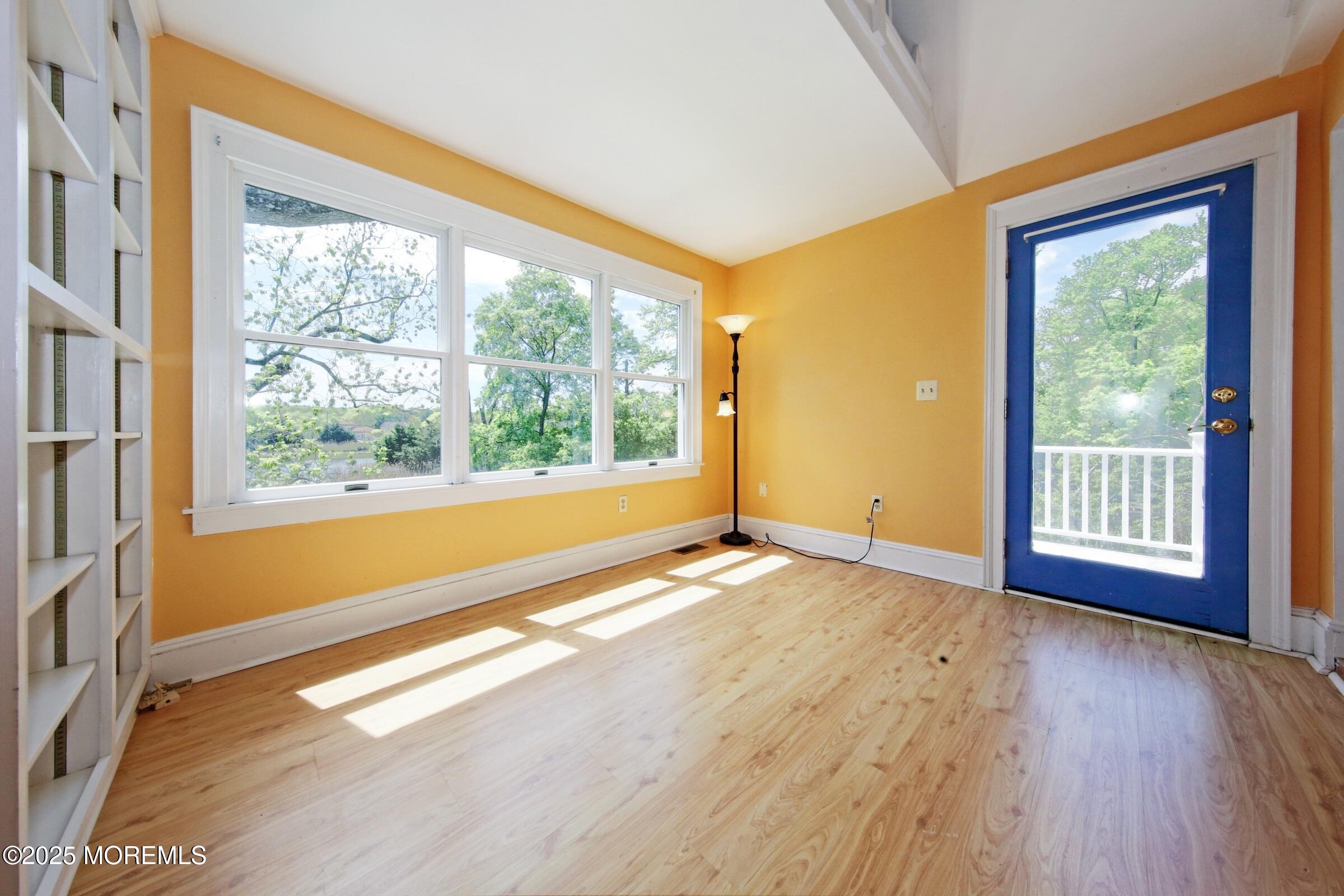 40 Riverside Avenue Oceanport, NJ 07757 - Photo 28 of 62 a view of an empty room and wooden floor and windows