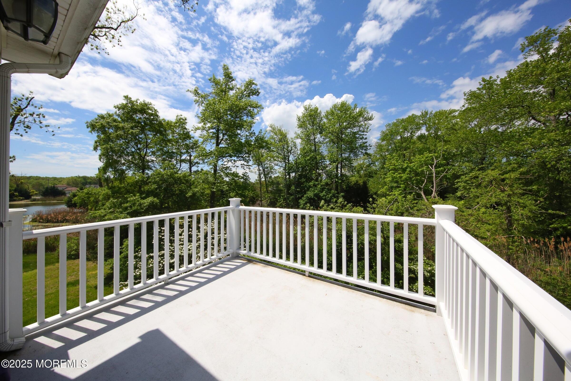 40 Riverside Avenue Oceanport, NJ 07757 - Photo 30 of 62 a view of balcony with wooden floor and trees