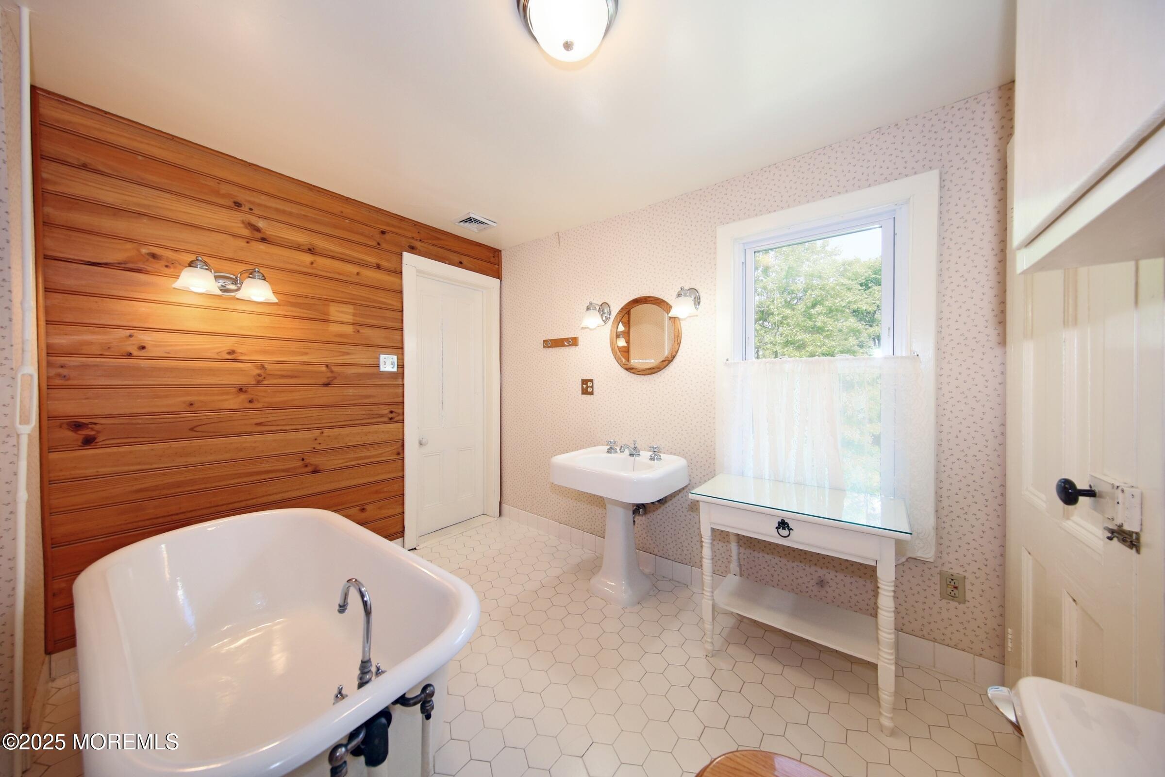 40 Riverside Avenue Oceanport, NJ 07757 - Photo 31 of 62 a bathroom with a sink a toilet and shower