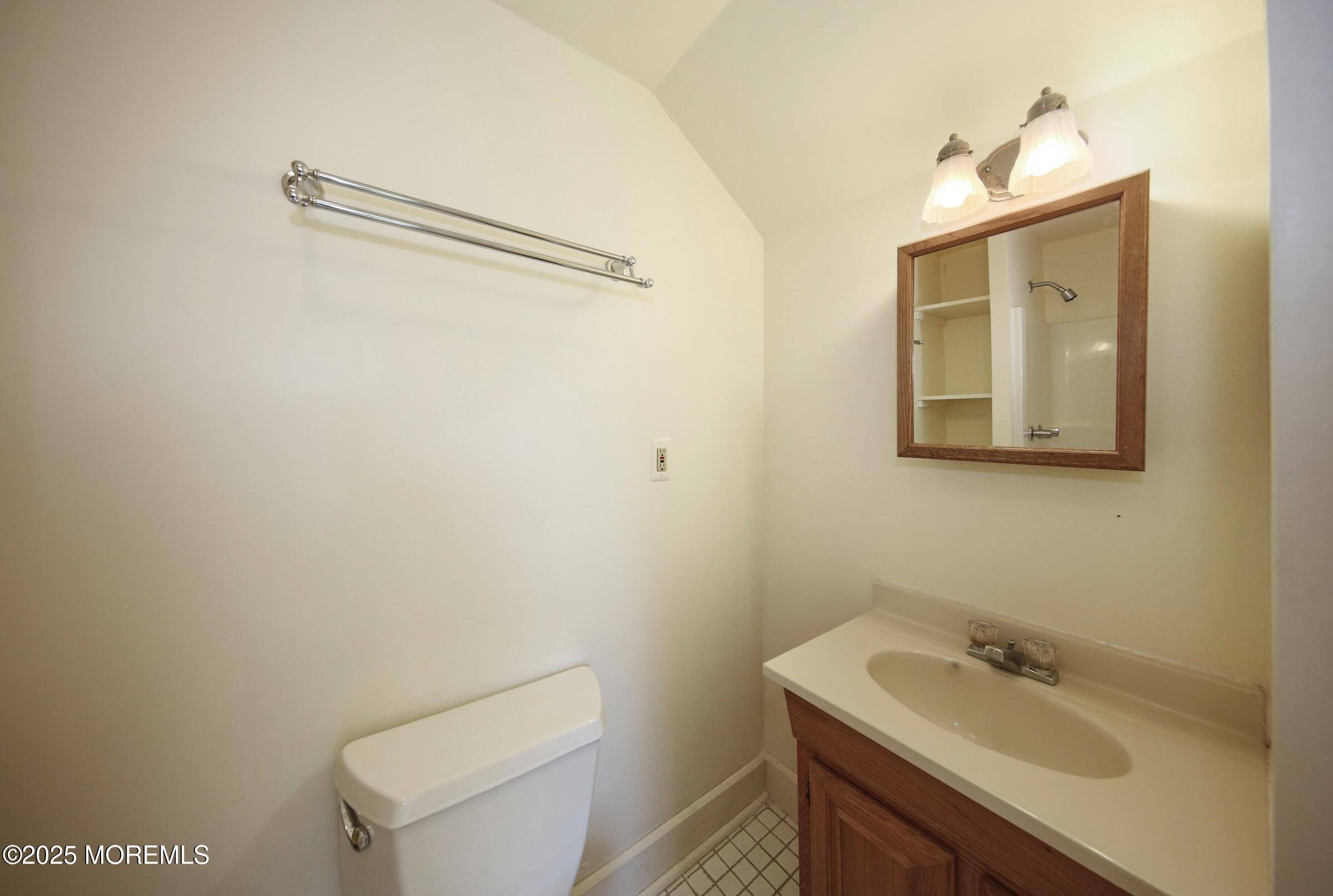 40 Riverside Avenue Oceanport, NJ 07757 - Photo 37 of 62 a bathroom with a sink mirror and toilet