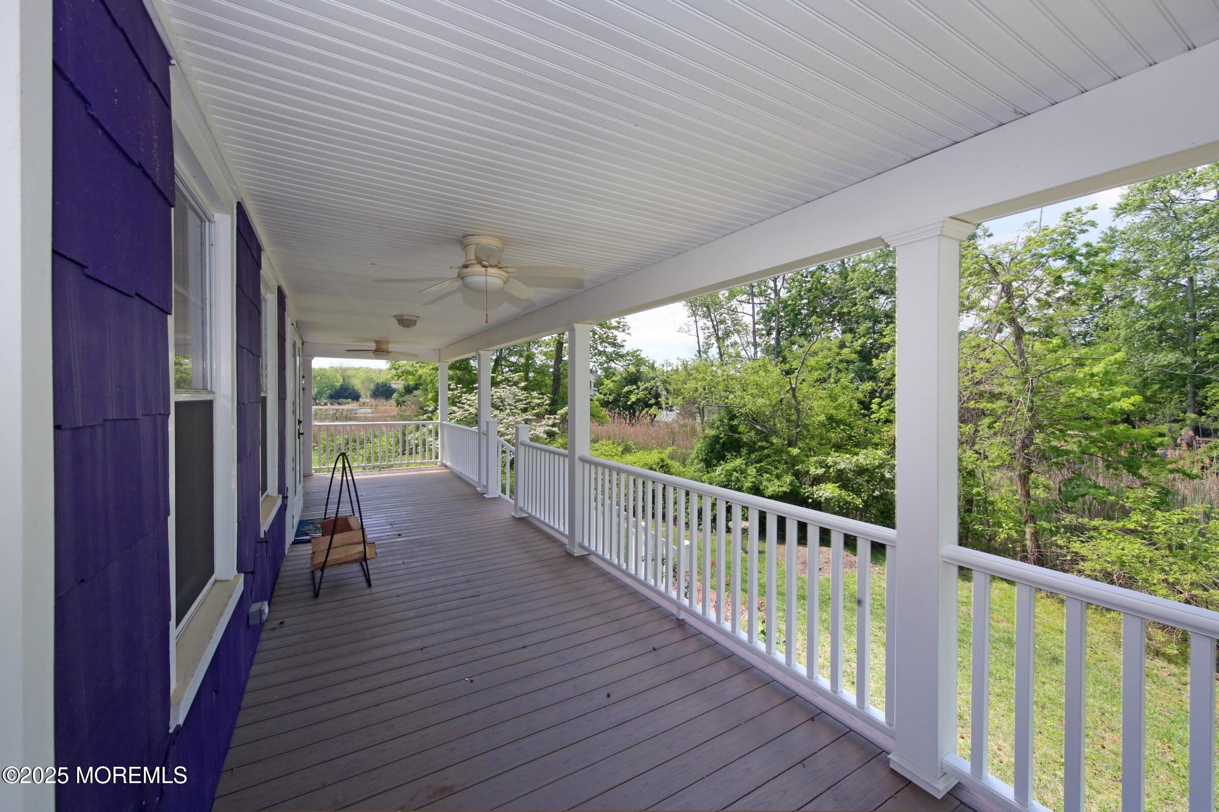 40 Riverside Avenue Oceanport, NJ 07757 - Photo 41 of 62 a view of a balcony with chairs and wooden floor