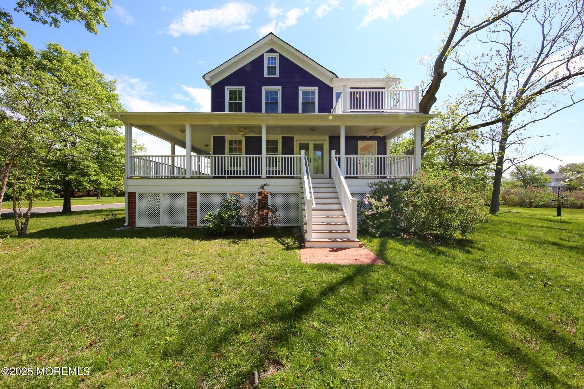 40 Riverside Avenue Oceanport, NJ 07757 - Photo 5 of 62 a front view of a house with a yard