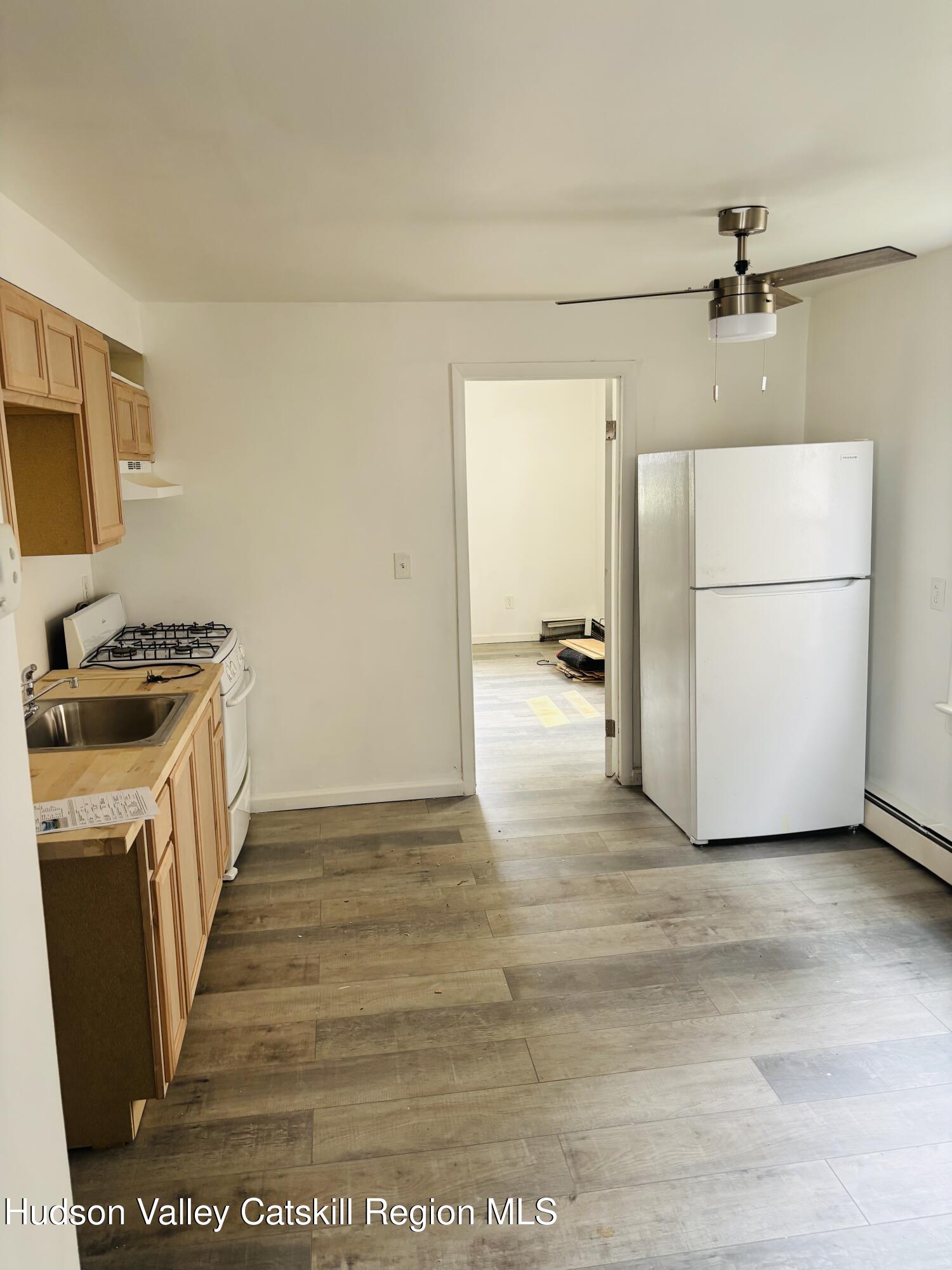 22-24 Jane Street, Unit 24A Saugerties, NY 12477 - Photo 8 of 11 a view of a kitchen with a sink and dishwasher