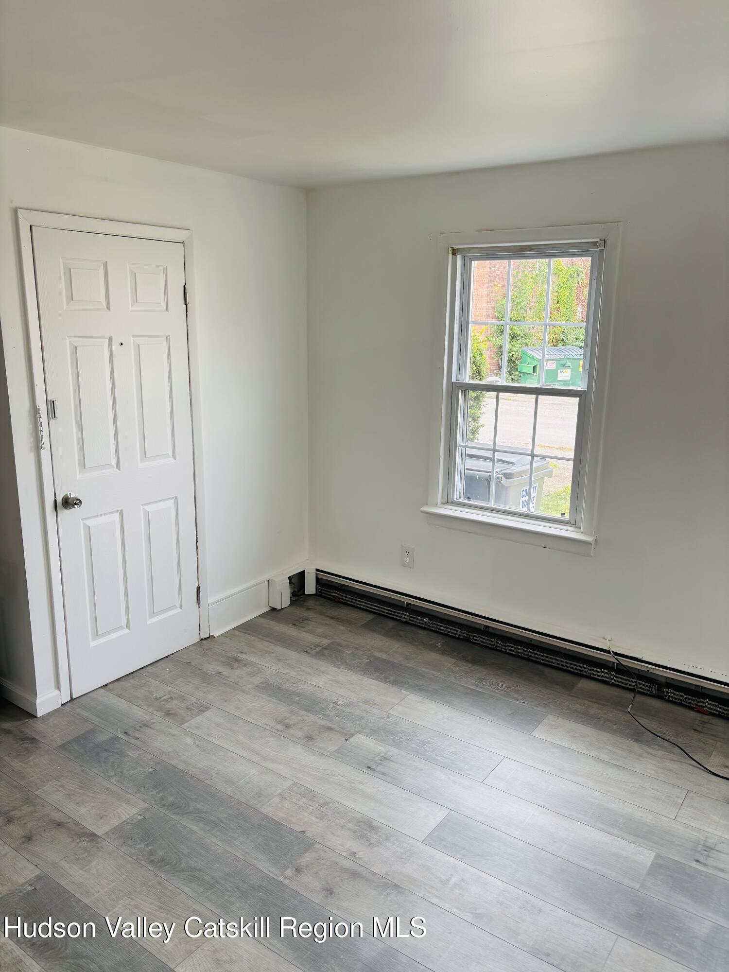 22-24 Jane Street, Unit 24A Saugerties, NY 12477 - Photo 9 of 11 an empty room with windows