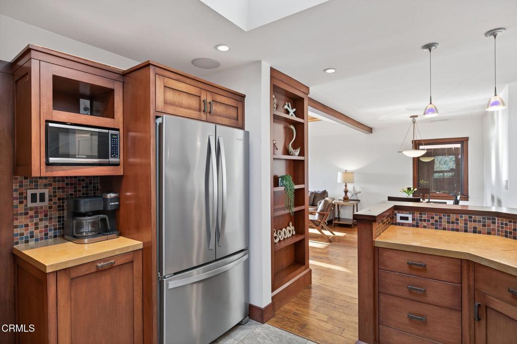 2916 Lakeshore Court Oxnard, CA 93035 - Photo 14 of 51 a kitchen with stainless steel appliances granite countertop a refrigerator and a stove top oven