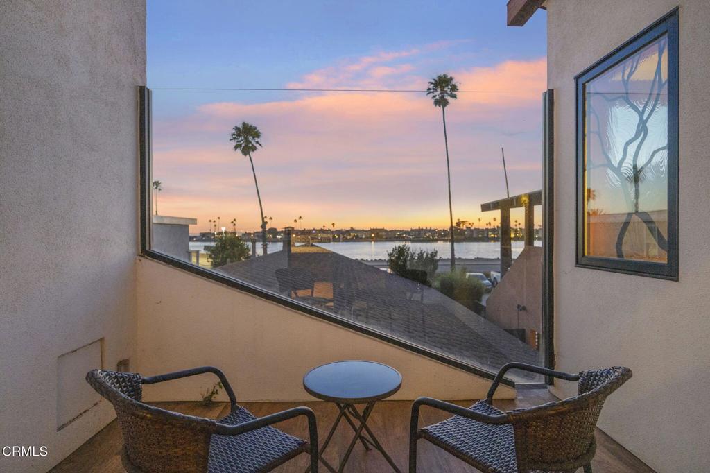 2916 Lakeshore Court Oxnard, CA 93035 - Photo 17 of 51 a view of a balcony with furniture and a potted plant