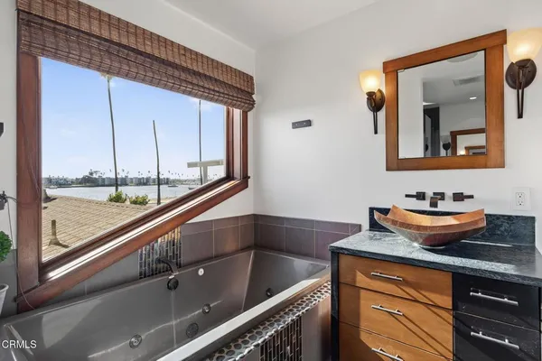 a bedroom with a bed and a view of bedroom
