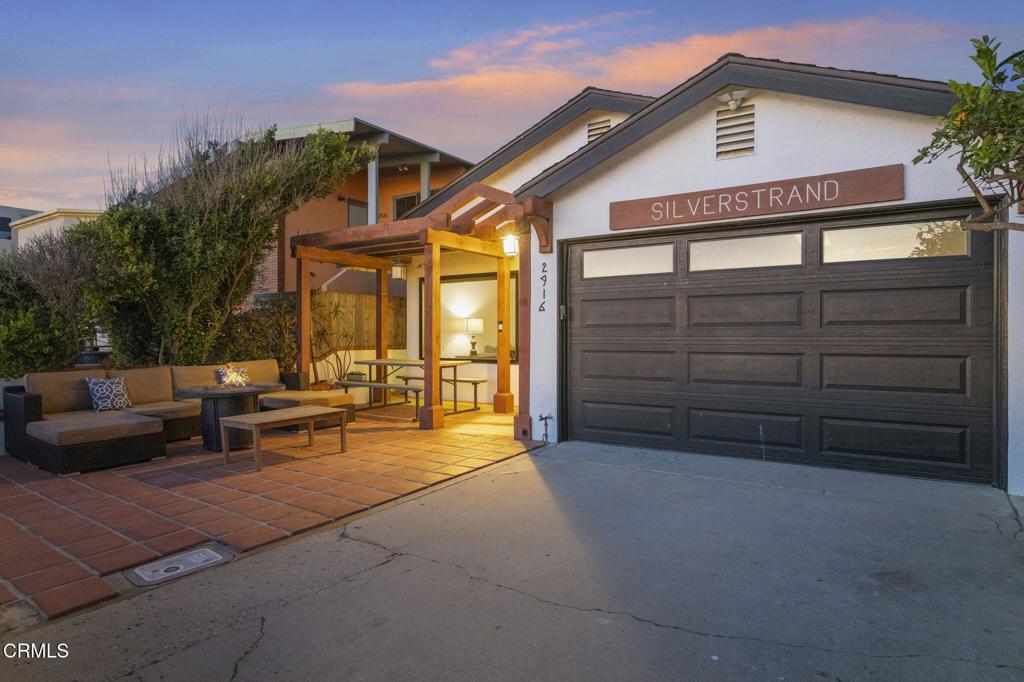 2916 Lakeshore Court Oxnard, CA 93035 - Photo 50 of 51 a view of a house with a large window and a lawn chair
