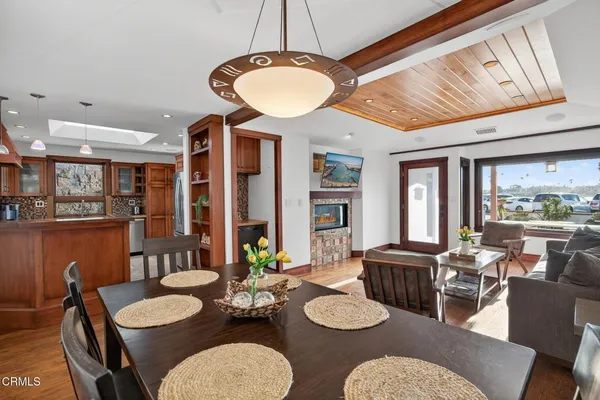 a kitchen with granite countertop a sink and a refrigerator