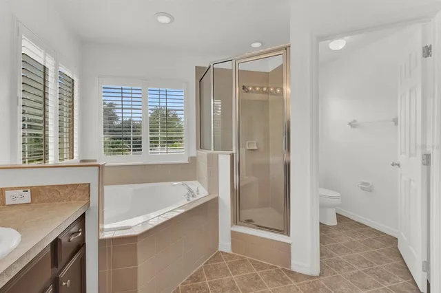 a bathroom with a shower and a bathtub