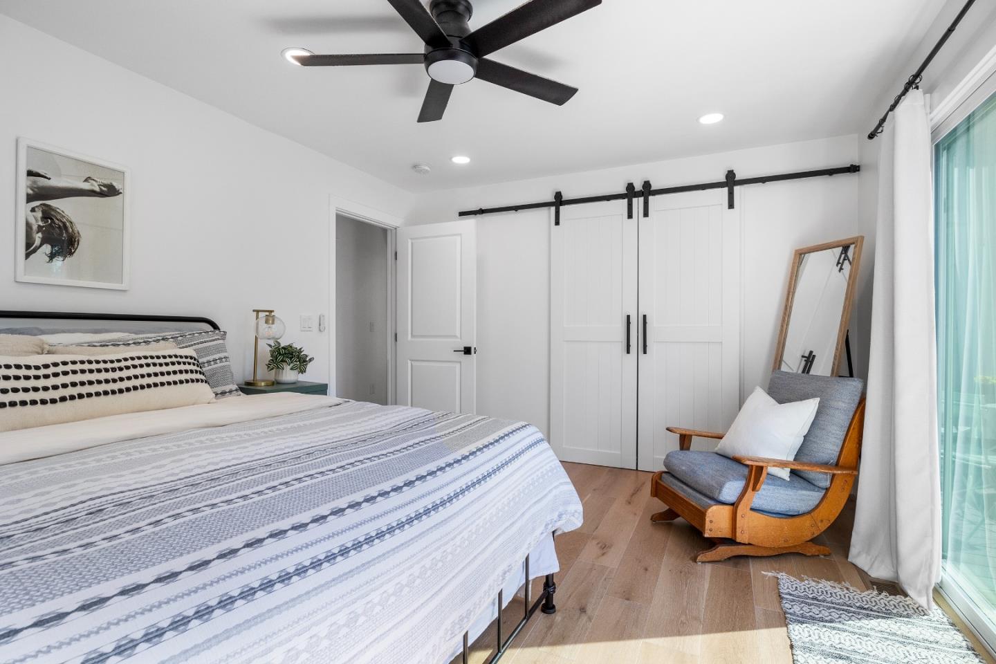 305 Sumner Avenue Aptos, CA 95003 - Photo 14 of 22 a bedroom with a bed and a chair