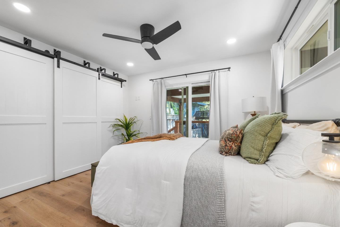 305 Sumner Avenue Aptos, CA 95003 - Photo 20 of 22 a bedroom with a large bed and a window