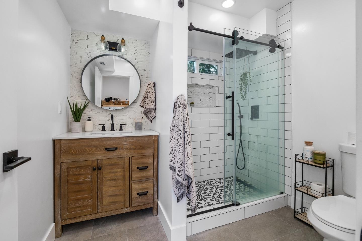 305 Sumner Avenue Aptos, CA 95003 - Photo 21 of 22 a bathroom with a sink a vanity and a mirror