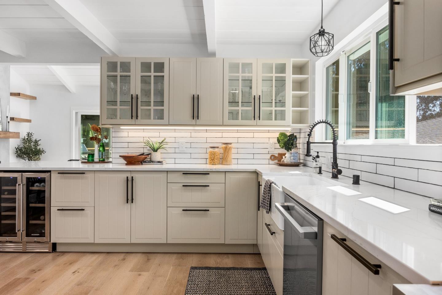 305 Sumner Avenue Aptos, CA 95003 - Photo 6 of 22 a kitchen with granite countertop a sink and white cabinets