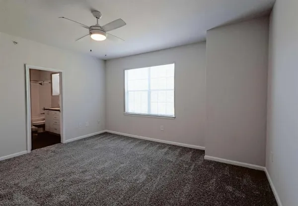an empty room with a bathroom