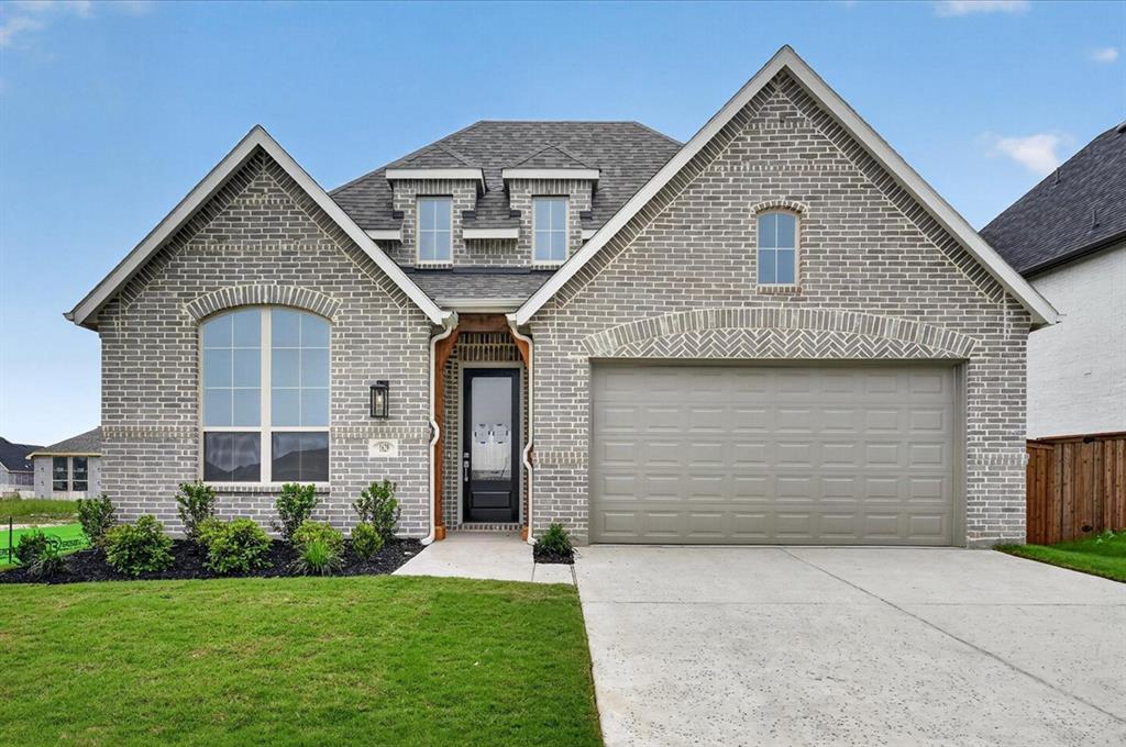 1629 Buscot Lane Fort Worth, TX 76052 - Photo 1 of 26 a front view of a house with a yard and garage