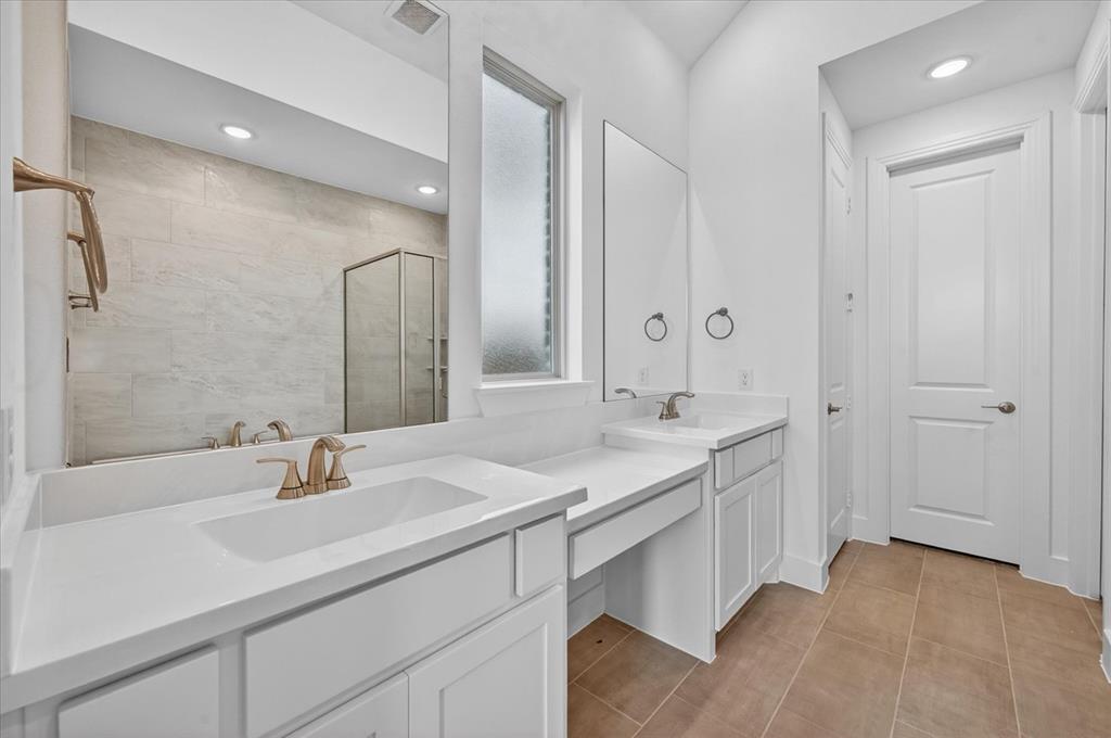 1629 Buscot Lane Fort Worth, TX 76052 - Photo 15 of 26 a bathroom with a sink and a mirror