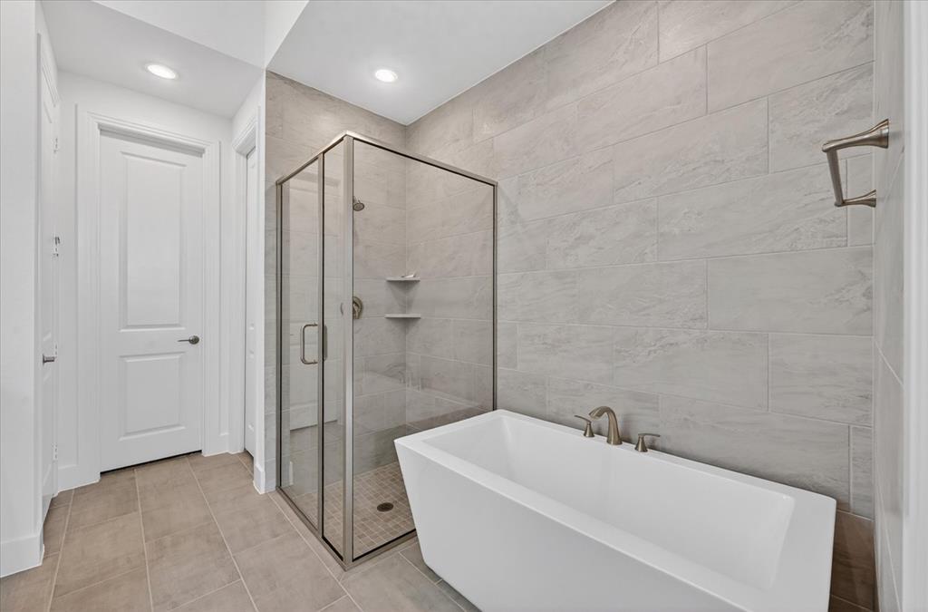 1629 Buscot Lane Fort Worth, TX 76052 - Photo 16 of 26 a bathroom with a bathtub and a shower