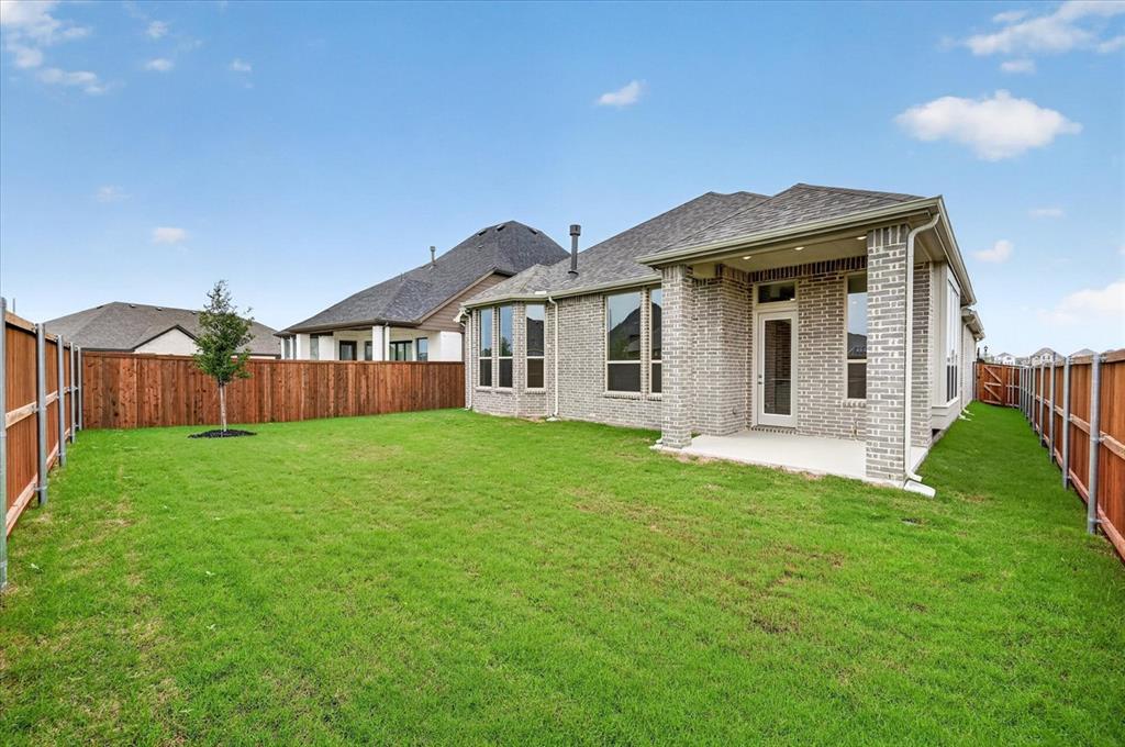 1629 Buscot Lane Fort Worth, TX 76052 - Photo 26 of 26 a view of a house with a yard and porch