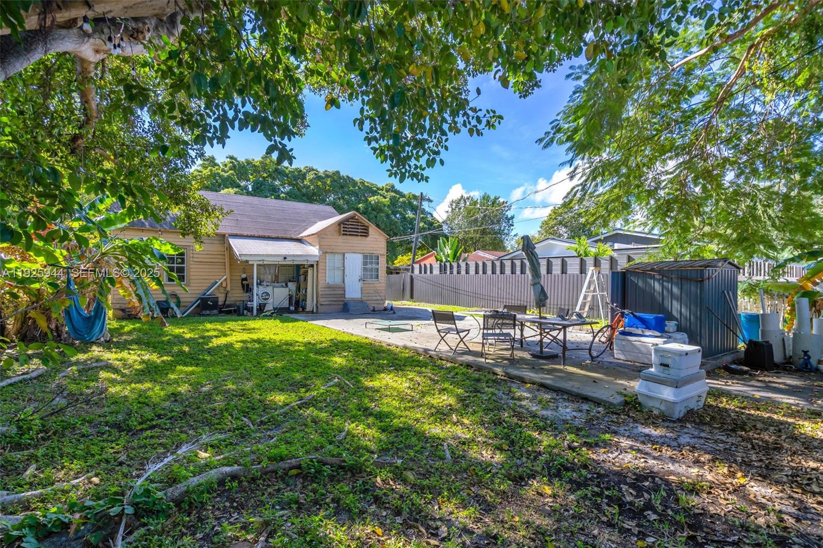 2271 Southwest 11th Street Miami, FL 33135 - Photo 14 of 17 a view of a chair and table in backyard