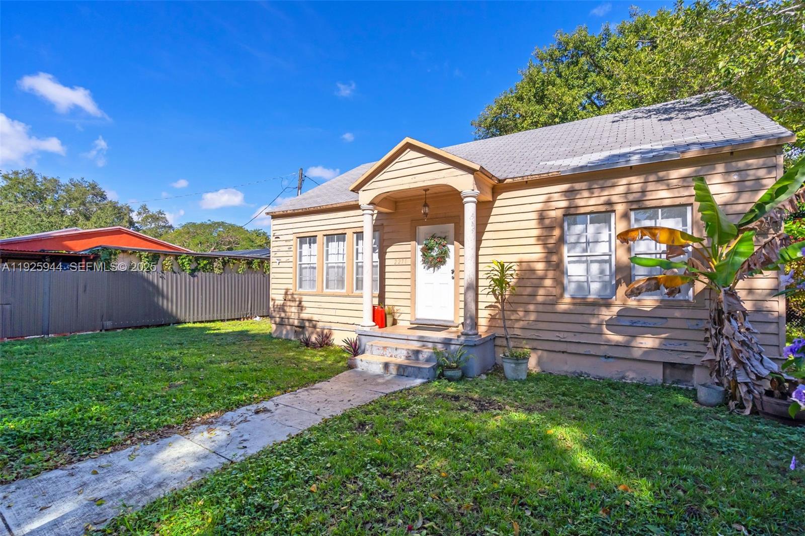 2271 Southwest 11th Street Miami, FL 33135 - Photo 3 of 17 a view of a house with a yard